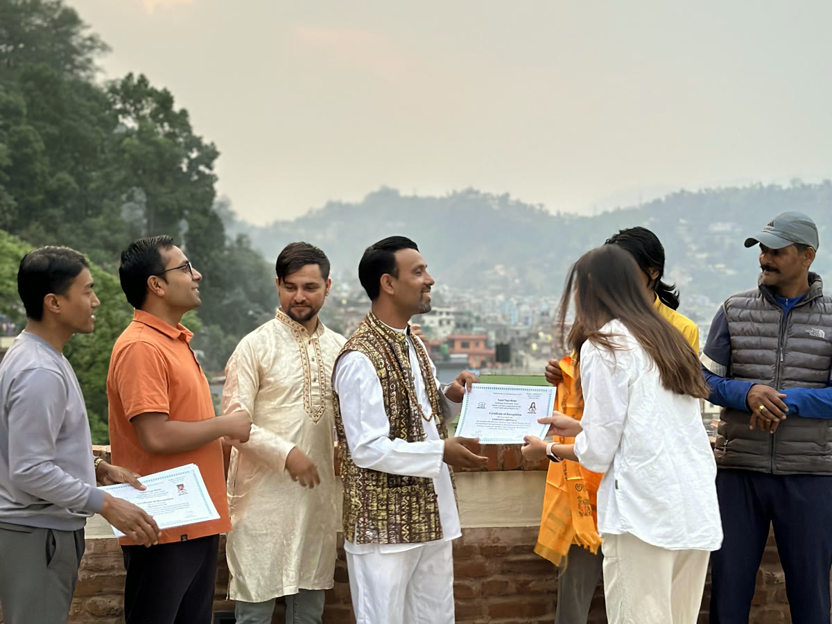 Yoga teacher training certificate ceremony on a rooftop above Kathmandu